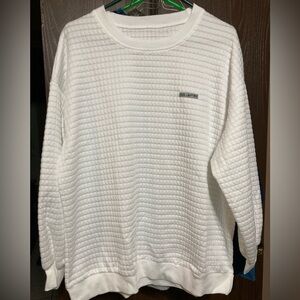 New waffle type material long sleeve women's shirt. Size L, 24" across chest.